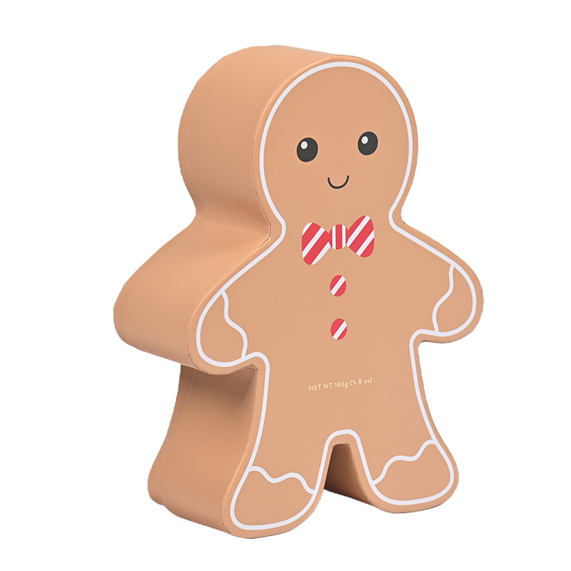 Abgewinkelte Sicht auf einen robusten Lebkuchen mann formte leere Geschenk box für Backwaren.