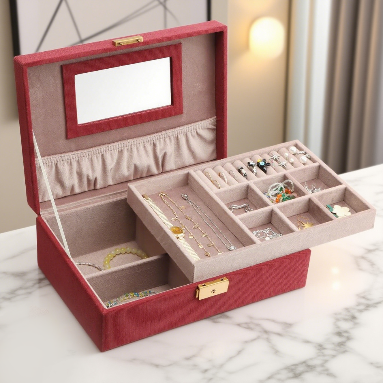 The image shows an open red jewelry box placed on a white. The box has a two - layer design. The top lid features a rectangular mirror framed in red, and the interior of the lid is lined with light