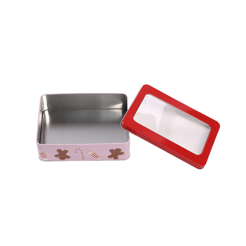 open rectangular Christmas tin box with red lid and gingerbread man patterns