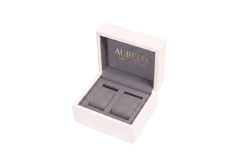 High-end white wooden watch display case with gold foil stamped logo inside
