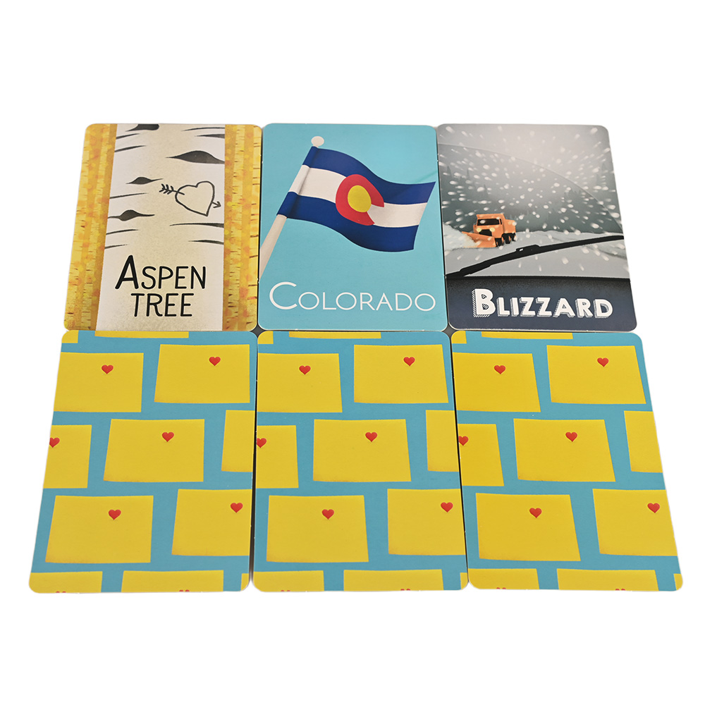 Close-up of educational flash cards featuring Colorado icons like Elk, Blizzard, and Sand Dunes.