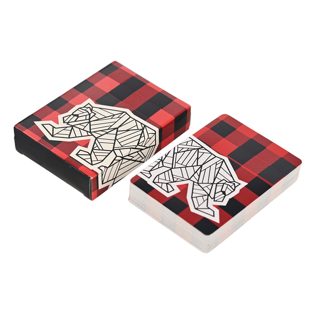 Luxury custom playing cards with red and black buffalo plaid pattern and geometric bear logo.