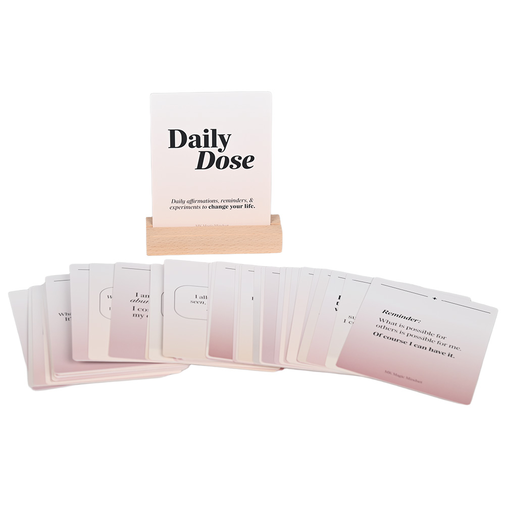 52-card affirmation deck with a natural wooden stand for desk display.