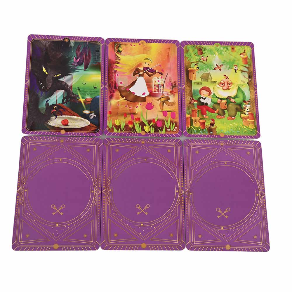 Close-up of card game back design with symmetrical key symbols and celestial patterns.