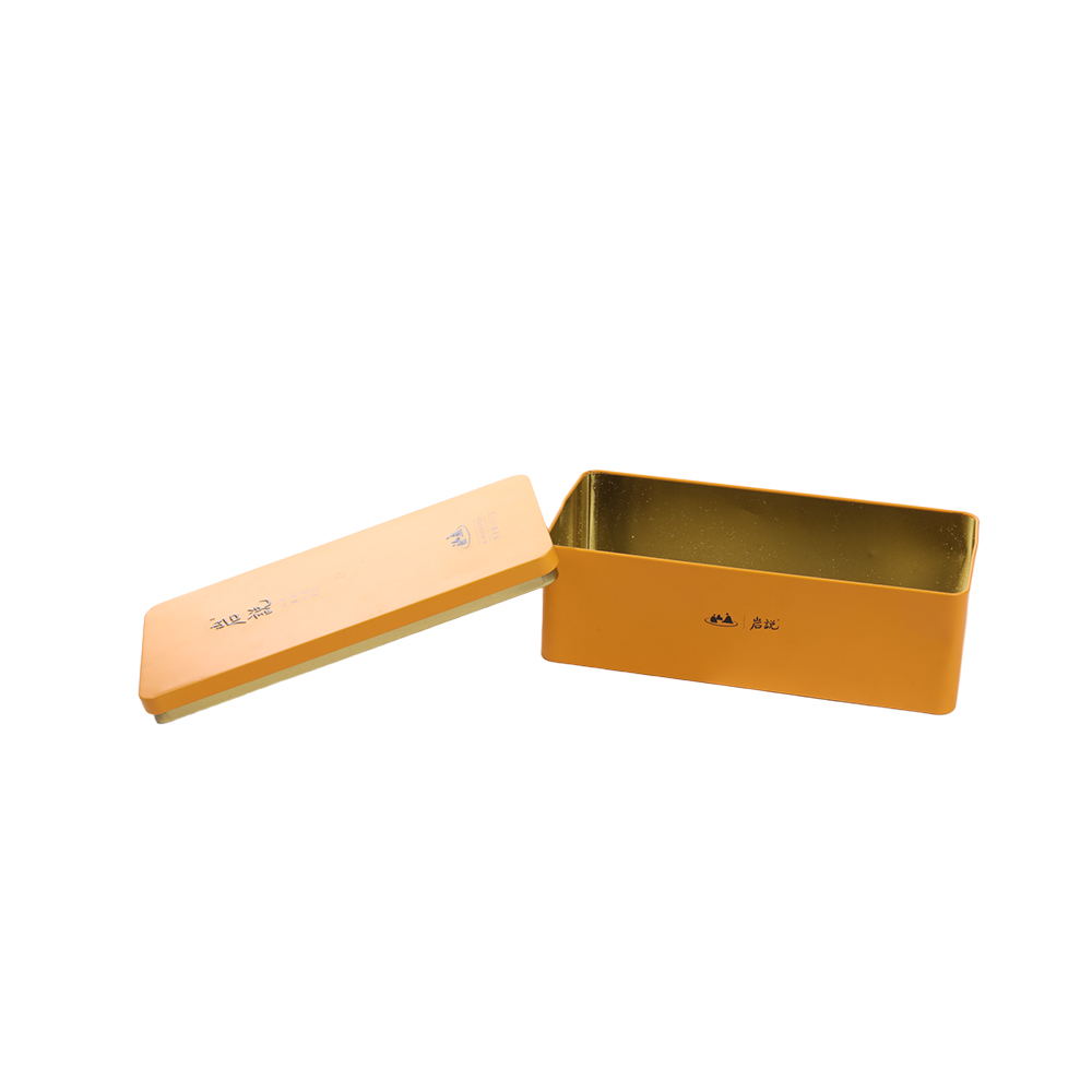 Open customized tea tin box showing food-grade gold lacquer coating interior.