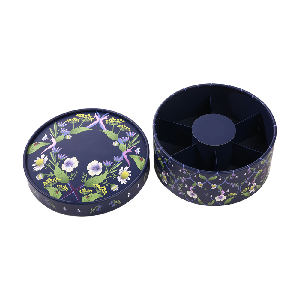 Open tea paper box revealing multi-compartment cardboard inner trays