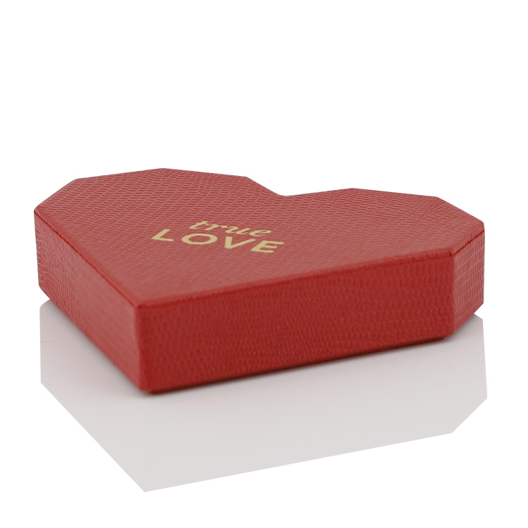 Angled view of red textured heart-shaped rigid gift box with gold true LOVE text