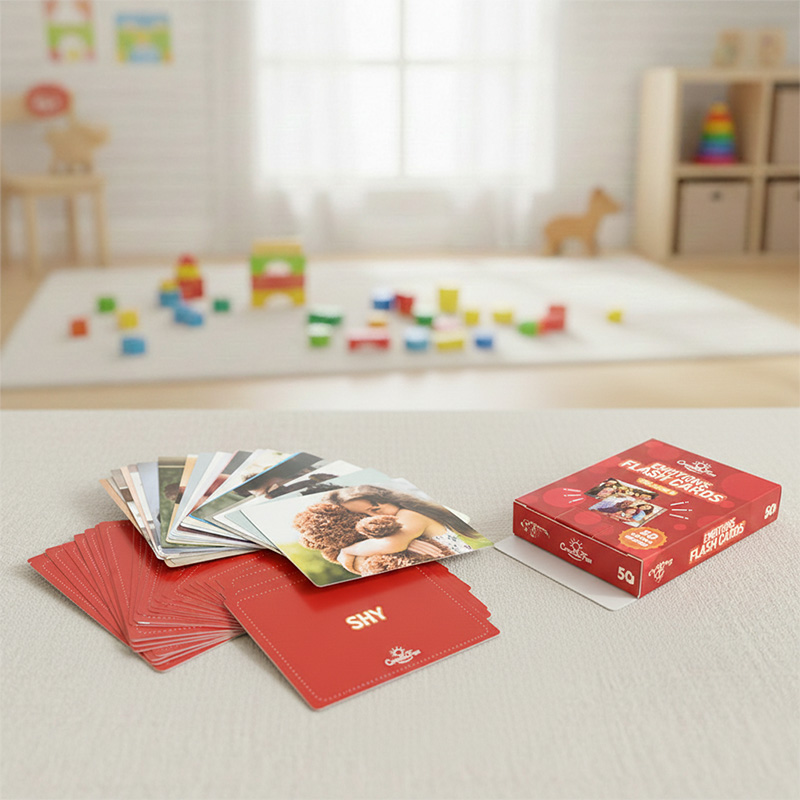 Emotions flash cards for social-emotional learning skills placed on a table in a cozy playroom.