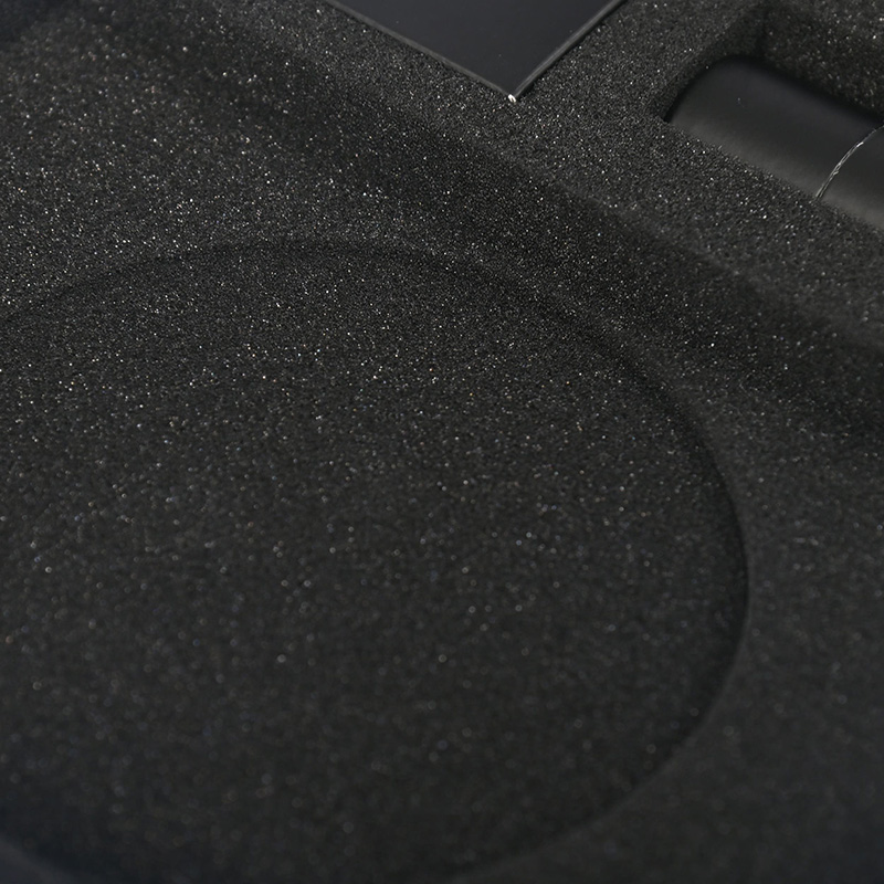 Detailed view of custom die-cut foam compartments for secure product packaging