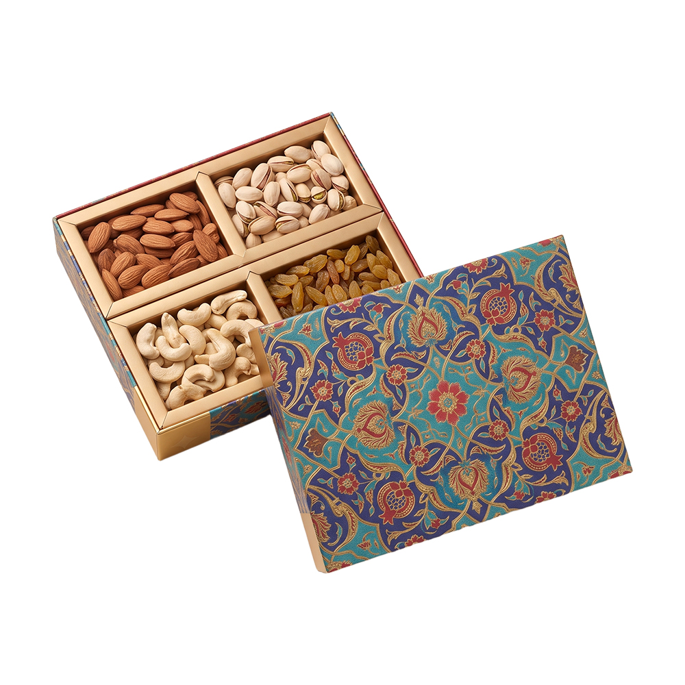 Opened Eid dry fruit box showing 4 compartments filled with almonds, pistachios, cashews, and raisins.