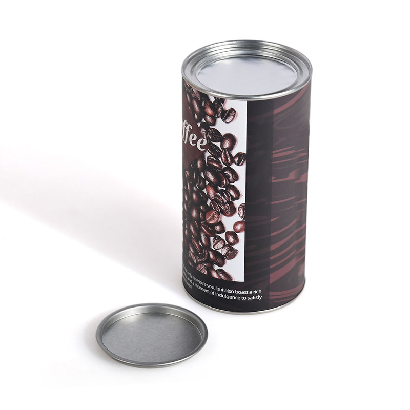 取り外した外側の金属蓋と内側のシールを示すコーヒー缶を開けました。