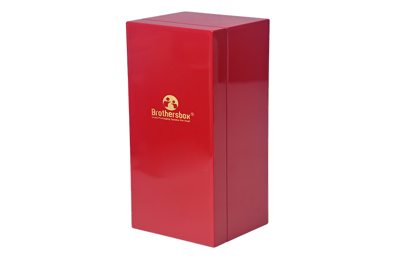 Right angled view of luxury high-gloss red wooden packaging box for wine bottles