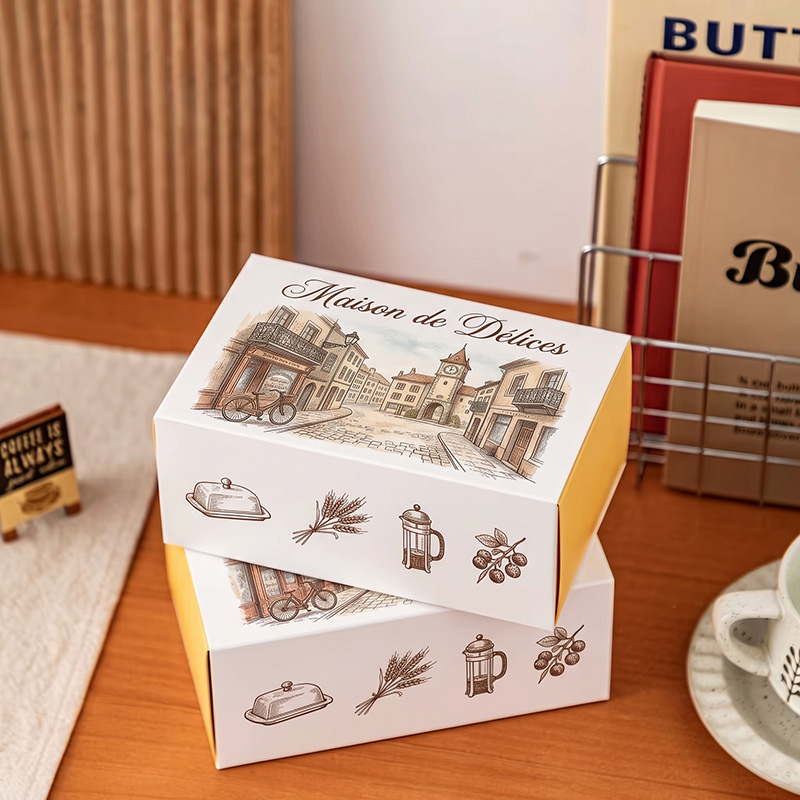 Cajas de chocolate con cajones semicirculares para la venta, cuidadosamente apiladas con un diseño cohesivo, creando una exhibición minorista premium.