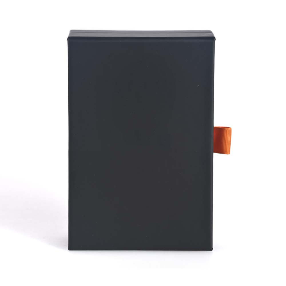 Custom matte black paper drawer box with an orange ribbon pull tab from Brothersbox