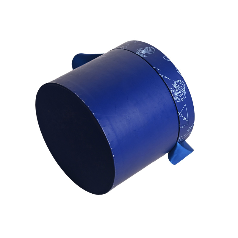 Tilted view of a sturdy blue cylindrical cardboard cake box base from Brothersbox.