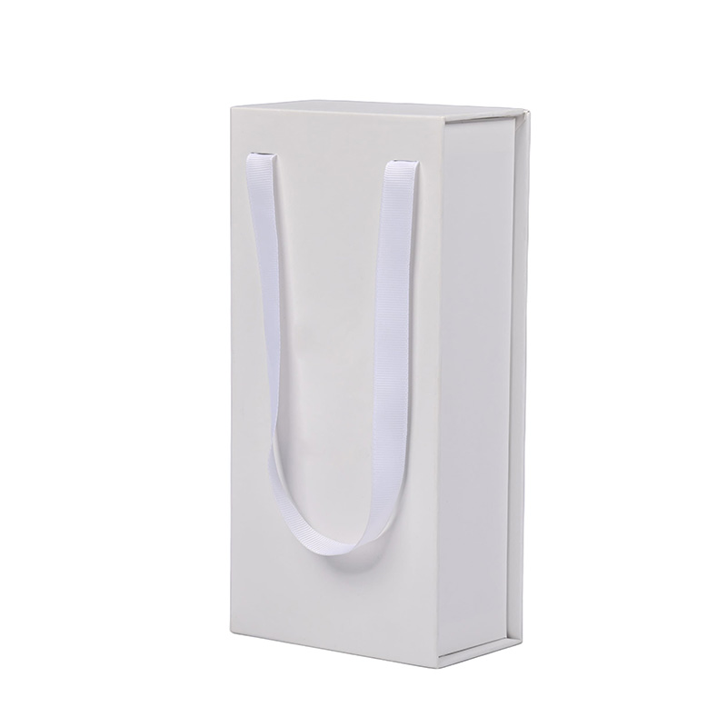 Side-angled view showing the magnetic flip-top closure and white ribbon handles.