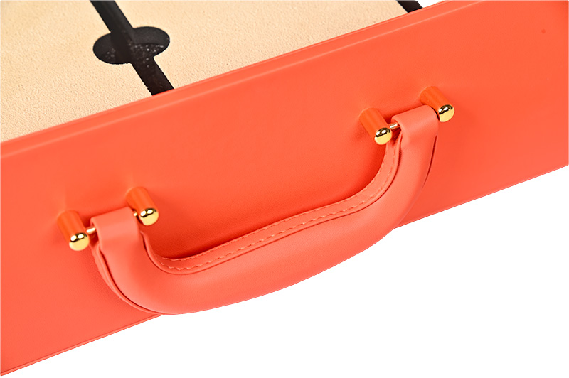 Ergonomic Coral Leather Handle with Gold Hardware Detail