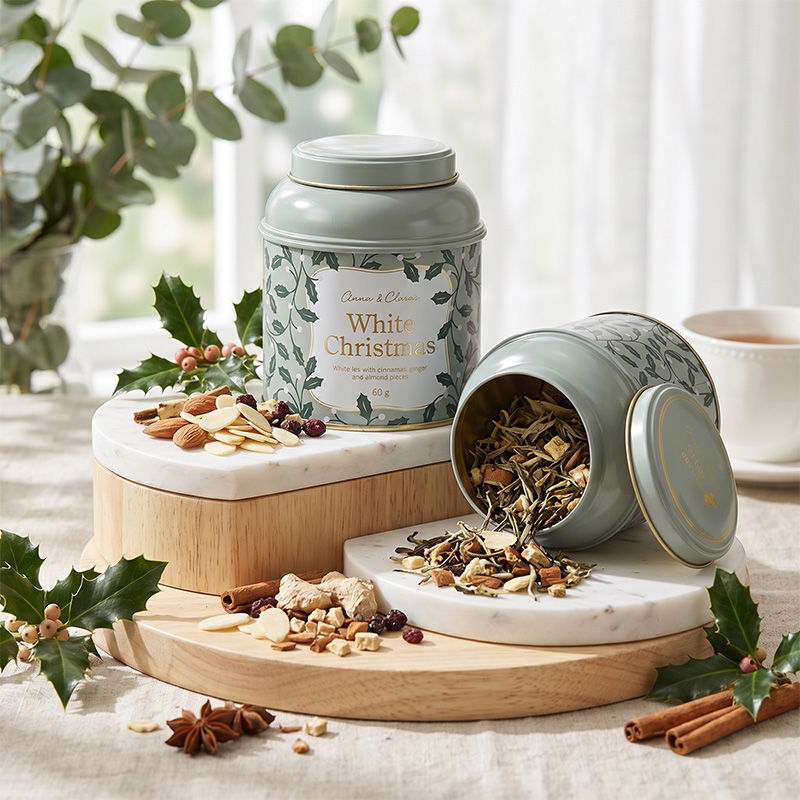 Elegant China Tea Tin Box with transparent gold coating displaying loose leaf holiday tea and spices