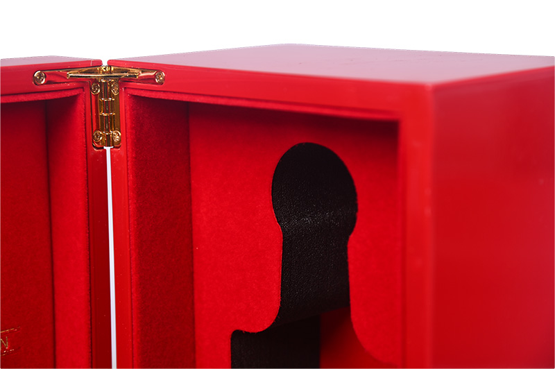 Detail shot of heavy-duty gold hardware and protective EVA foam in custom red wine box