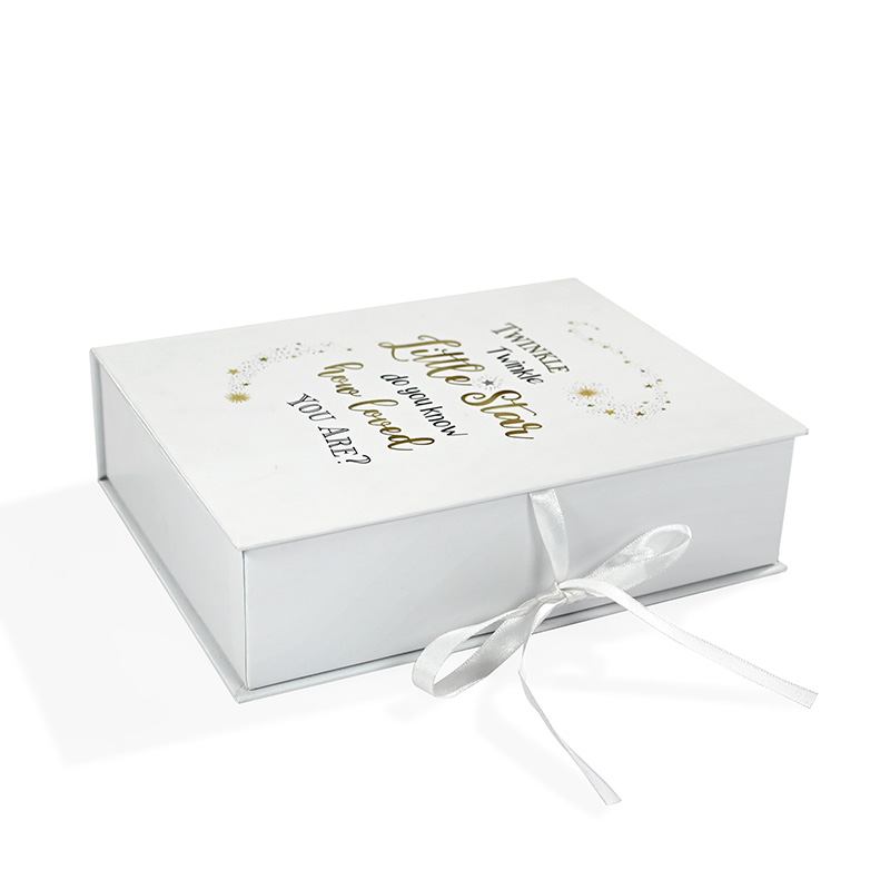 Flat closed view of paper baby keepsake box with elegant gold foil star design for wholesale.