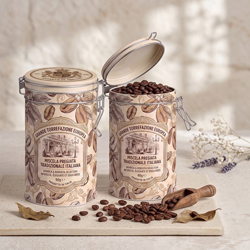 Open Brothersbox coffee tin filled with fresh dark roast beans and a wooden scoop